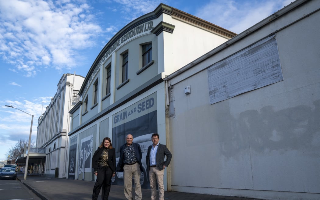Hastings mayor Sandra Hazlehurst (left), Stead Construction project design manager Mark Baylis and Mike Walker Management Ltd director Mike Walker outside the Queen St building set for redevelopment.