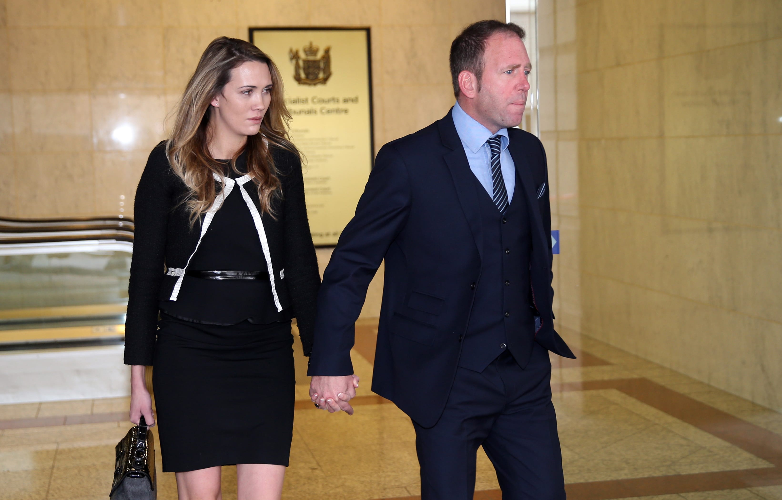 Ex-Megaupload executive Finn Batato and his wife Anastasia leave court for lunch