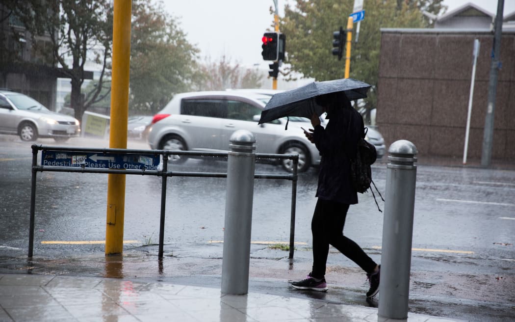 Rain pours down in the Auckland CBD.