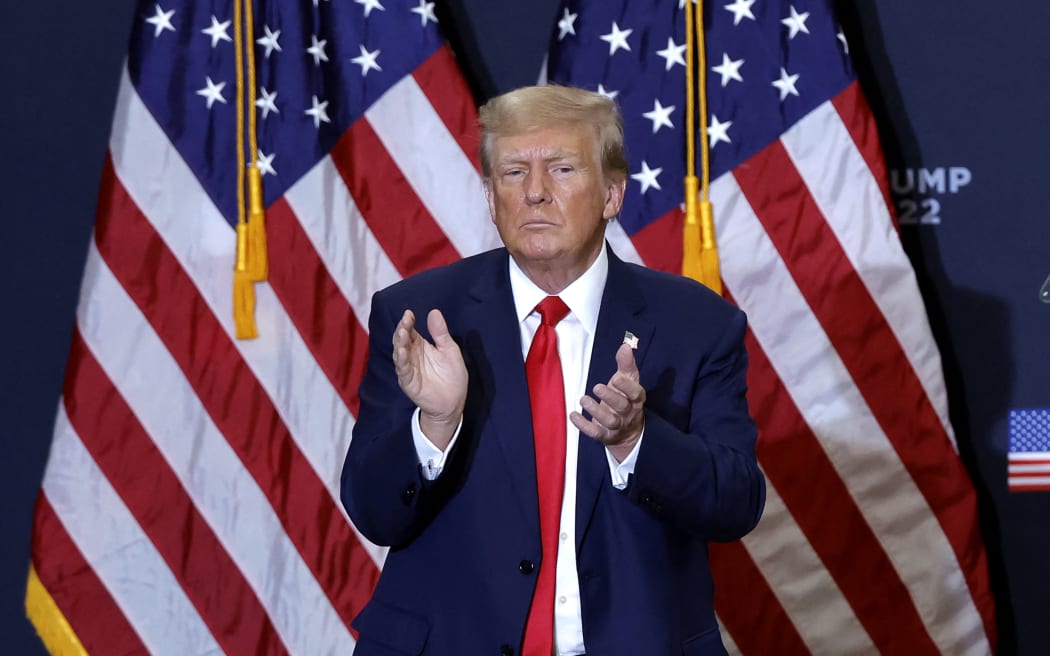 Former US President and 2024 presidential hopeful Donald Trump applauds at the end of a campaign event in Waterloo, Iowa, on December 19, 2023. An appeals court in Colorado on December 19, 2023 ruled Donald Trump cannot appear on the state's presidential primary ballot because of his involvement in the attack on the Capitol in January 2021. (Photo by KAMIL KRZACZYNSKI / AFP)