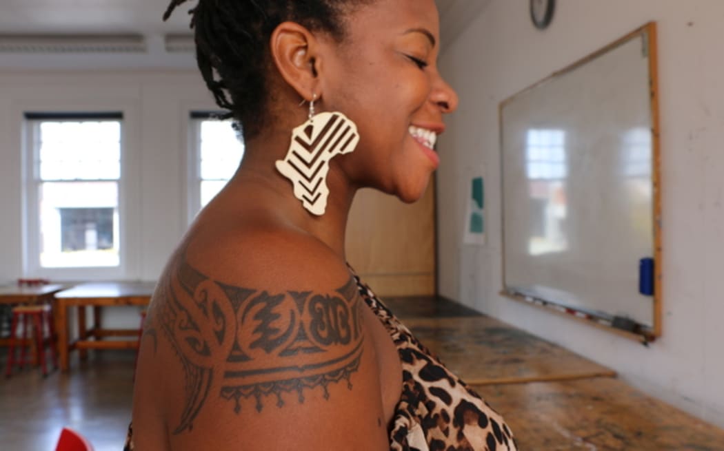 "I try every single day to have something on me that represents Africa." Makanaka Tuwe shows off her earrings.