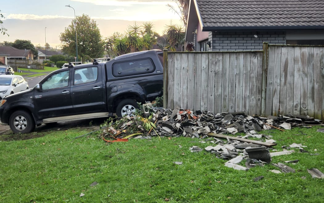 Tiles and wood debris along Ballybay Road in East Tamaki following a tornado on 9 April.