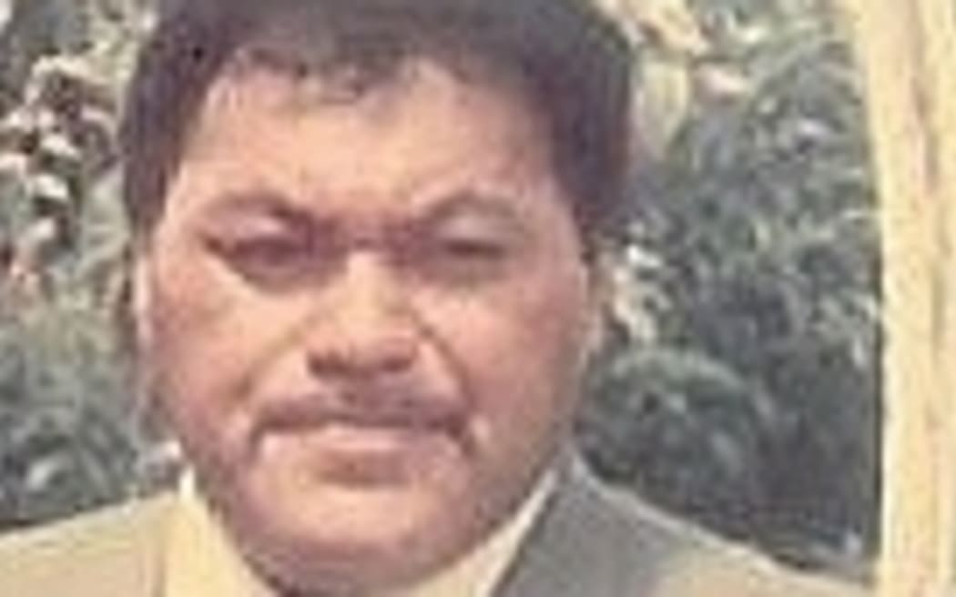 Archival image of Darcy Te Hira wearing a grey suit.