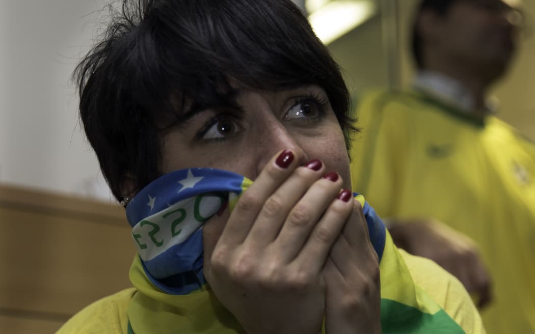 090714. Photo Diego Opatowski / RNZ. A Brazil's fan reacts in the brazilian embassy after Germany defeated Brazil during the 2014 FIFA World Cup semifinal match.