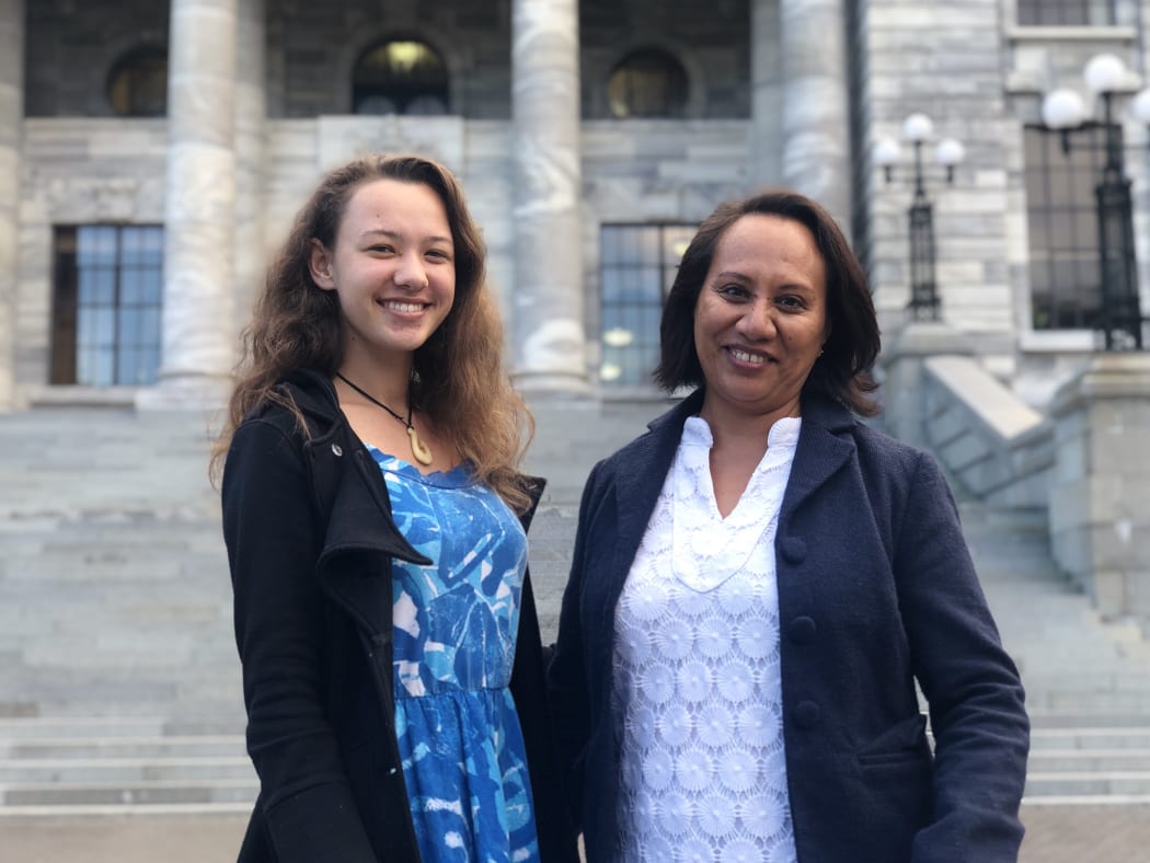 Journalist Tiana Haxton (left) from the Cook Islands and journalist Esther Pavihi from Niue stand outside Parliament House in Wellington.