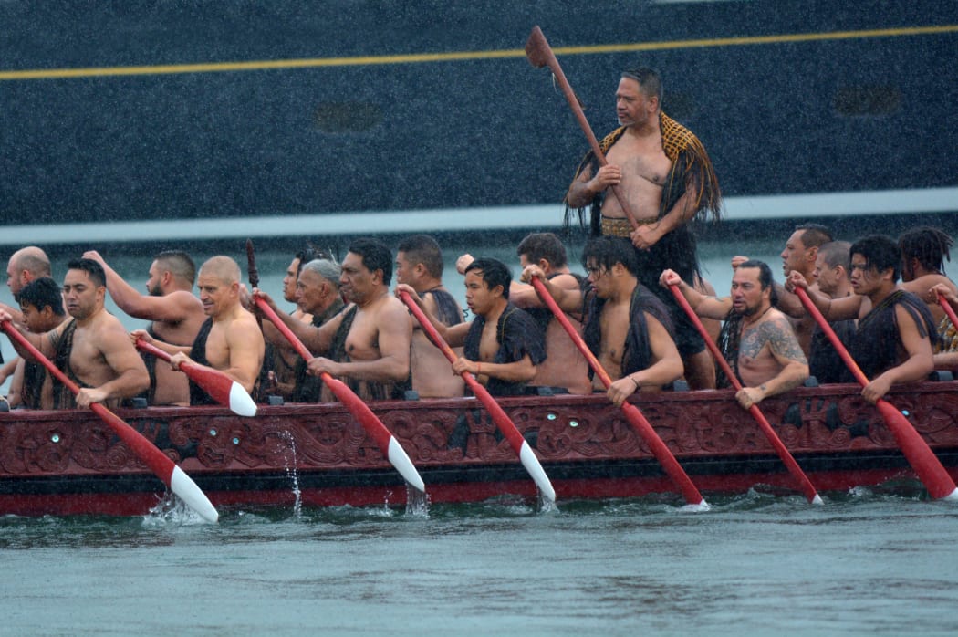 Māori waka sailing in Auckland, New Zealand.