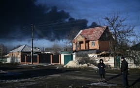 Black smoke rises from a military airport in Chuguyev near Kharkiv  on February 24, 2022.