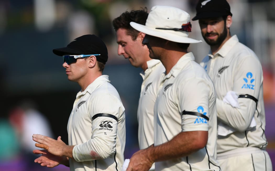 Stand-in captain Tom Latham leads the Black Caps off the SCG.