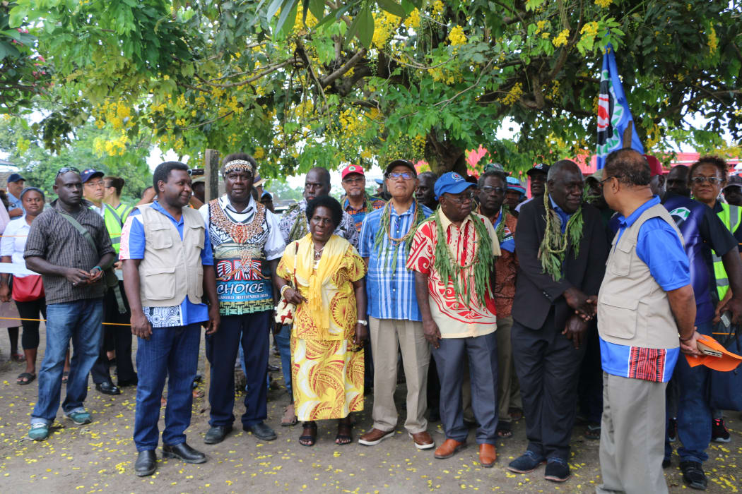 Bougainville's retiring president, John Momis (centre with blue and white shirt) alongside his wife Elizabeth and other officials at Bel Isi Park in Buka at the commencement of polling in the autonomous Papua New Guinea region's independence referendum, November 2019.