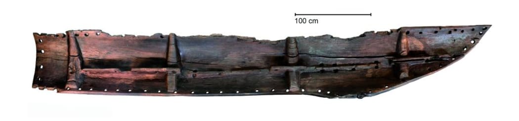 This six-metre-long plank, which was part of a canoe hull, was found in a swamp on the north-west coast of the South Island.