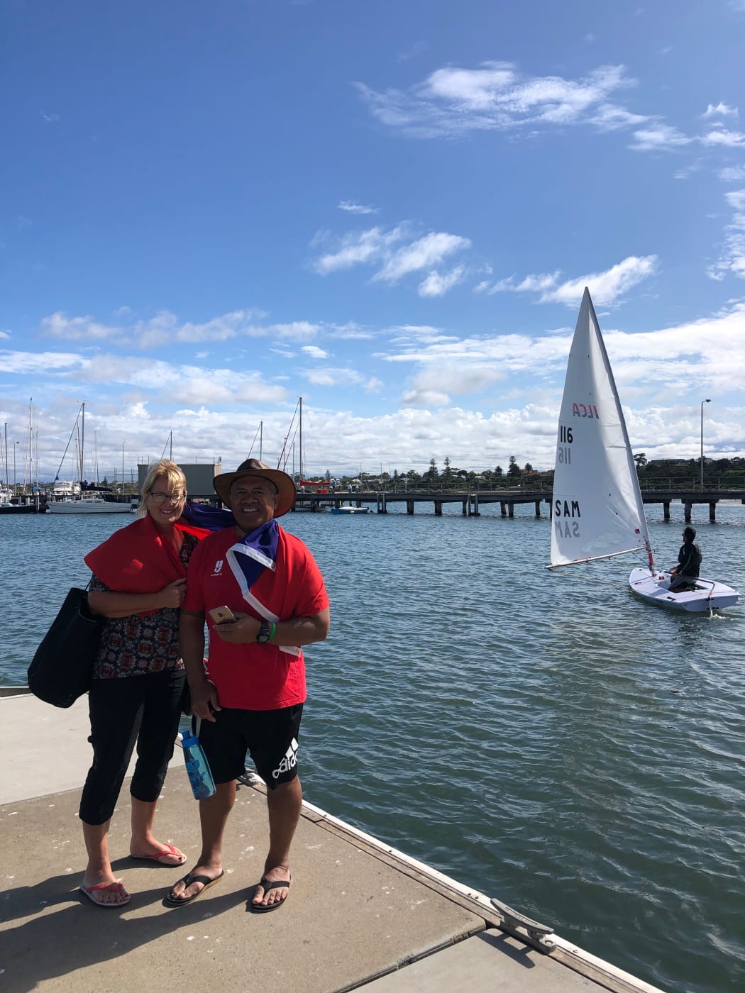 Leilua's parents supporting from the dock.