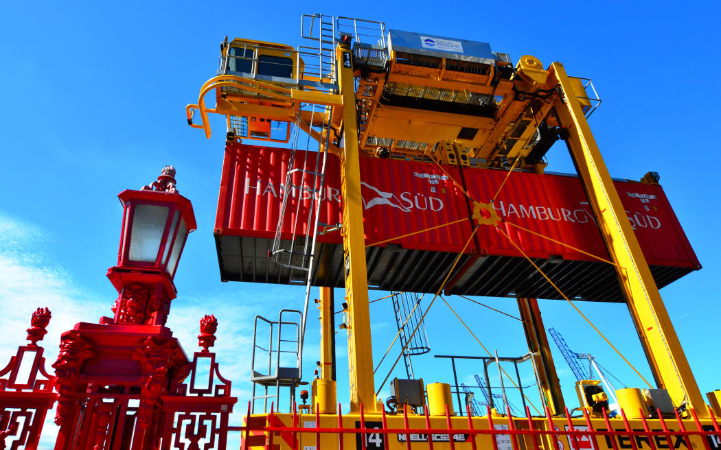 Straddle carriers and containers on Fergusson Wharf at Ports of Auckland.