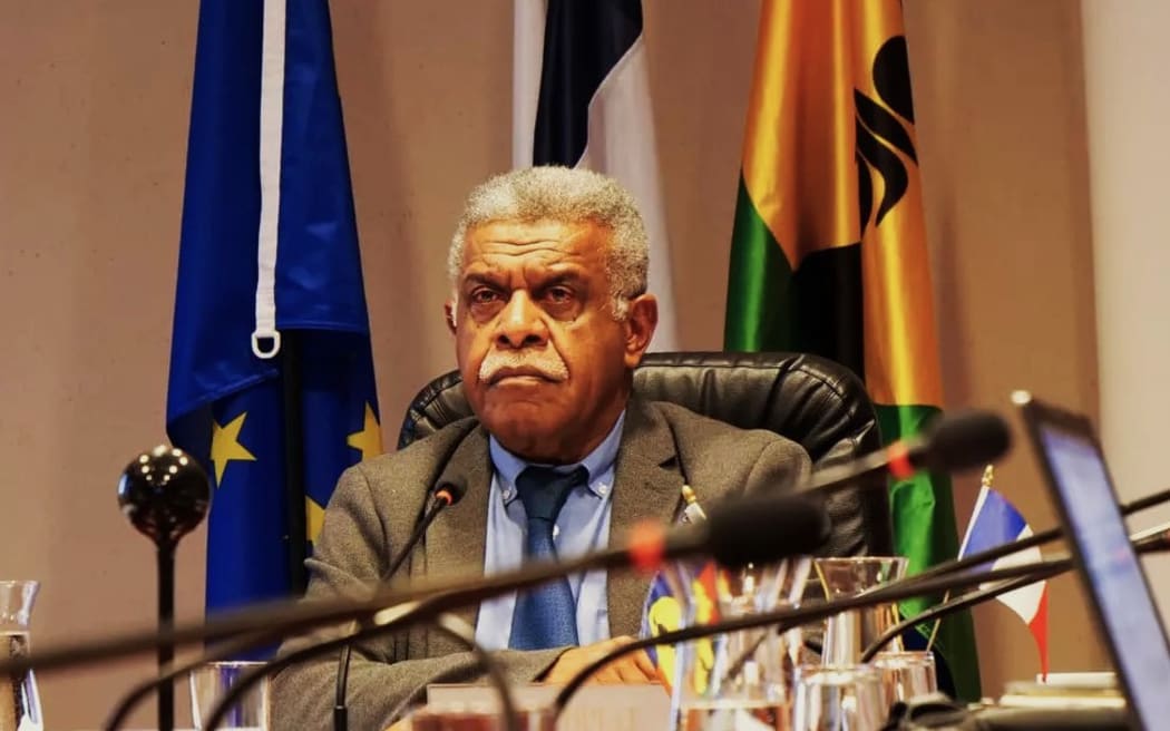New Caledonia's President Louis-Mapou with flags - PHOTO Gouvernement de la Nouvelle-Calédonie