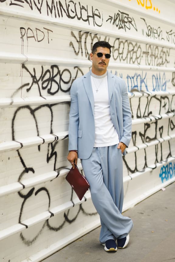 Kadu Dantas, wearing Acne Studio white t shirt and light blue suit, is seen in the streets of Paris before the Acne Studio show, during Paris Men's Fashion Week Spring/Summer 2019 on June 20, 2018 in Paris, France.  (Photo by Nataliya Petrova/NurPhoto) (Photo by Nataliya Petrova / NurPhoto / NurPhoto via AFP)