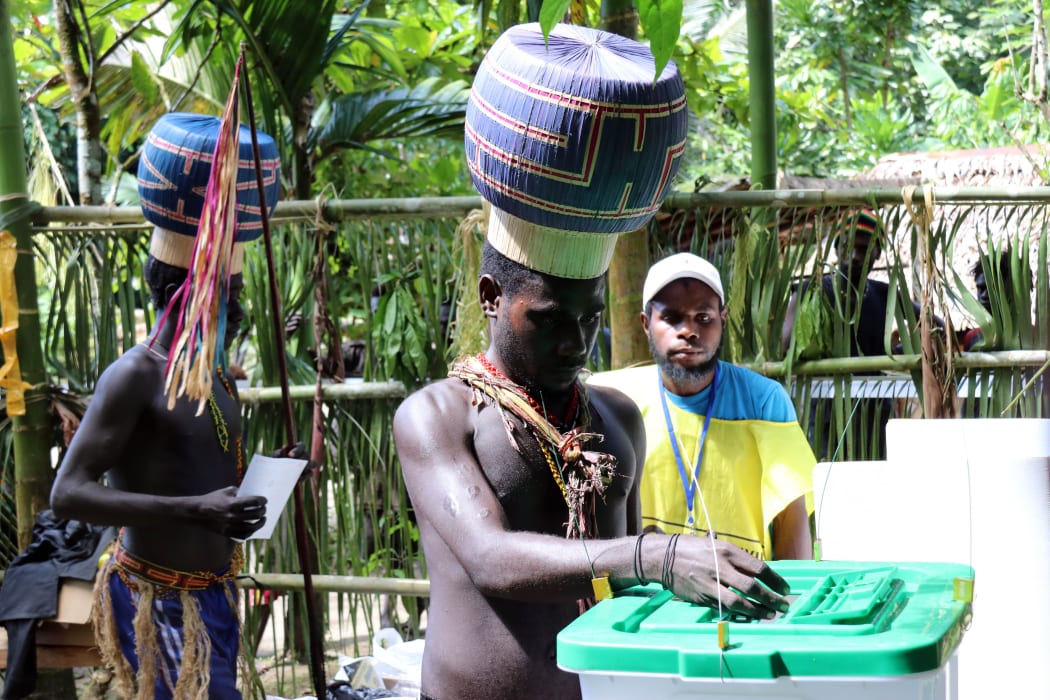 Young Upe men casting their votes in the Bougainville Referendum.