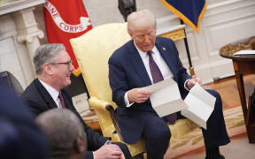 WASHINGTON, DC - FEBRUARY 27: U.S. President Donald Trump reads a letter from King Charles III given to him by British Prime Minister Keir Starmer (L) during a meeting in the Oval Office at the White House on February 27, 2025 in Washington, DC. Starmer is on his first visit to Washington since President Trump returned to the White House. Starmer's trip comes shortly after he announced an increase in UK defense spending, ostensibly as a signal to Trump that the UK is prepared to bolster Europe's security, and as he aims to broker a fair peace deal for Ukraine amid Trump's warming relations with Russia. (Photo by Andrew Harnik/Getty Images)