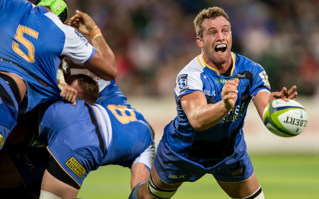 Angus Cottrell of the Western Force shovels out a pass from a breakdown