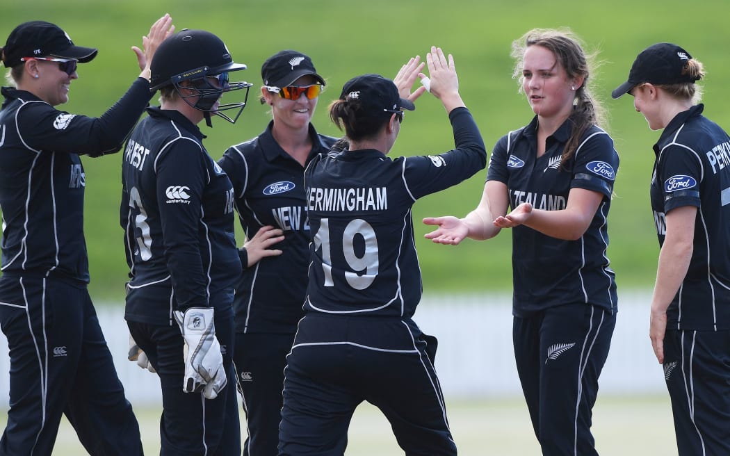 New Zealand's Amelia Kerr celebrates with team mates