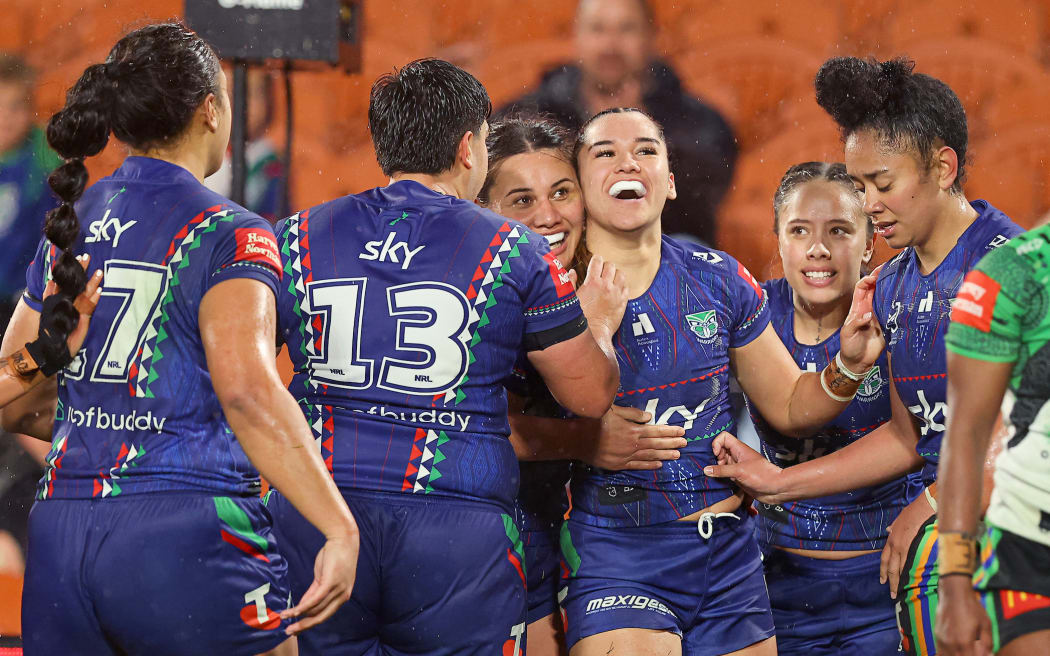 Warriors winger Payton Takimoana celebrates her third try with teammates.
NZ Warriors v Canberra Raiders.