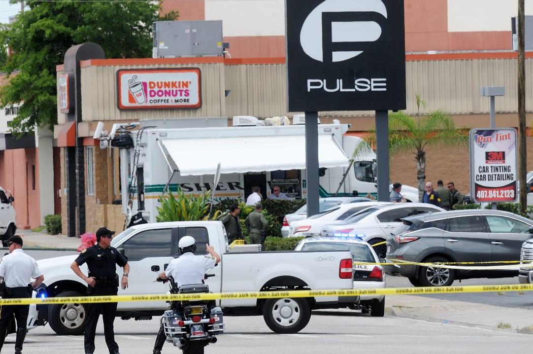ORLANDO, FLORIDA - JUNE 12: Orlando police officers seen outside of Pulse nightclub after a fatal shooting and hostage situation on June 12, 2016 in Orlando, Florida. The suspected shooter, Omar Mateen, was shot and killed by police.