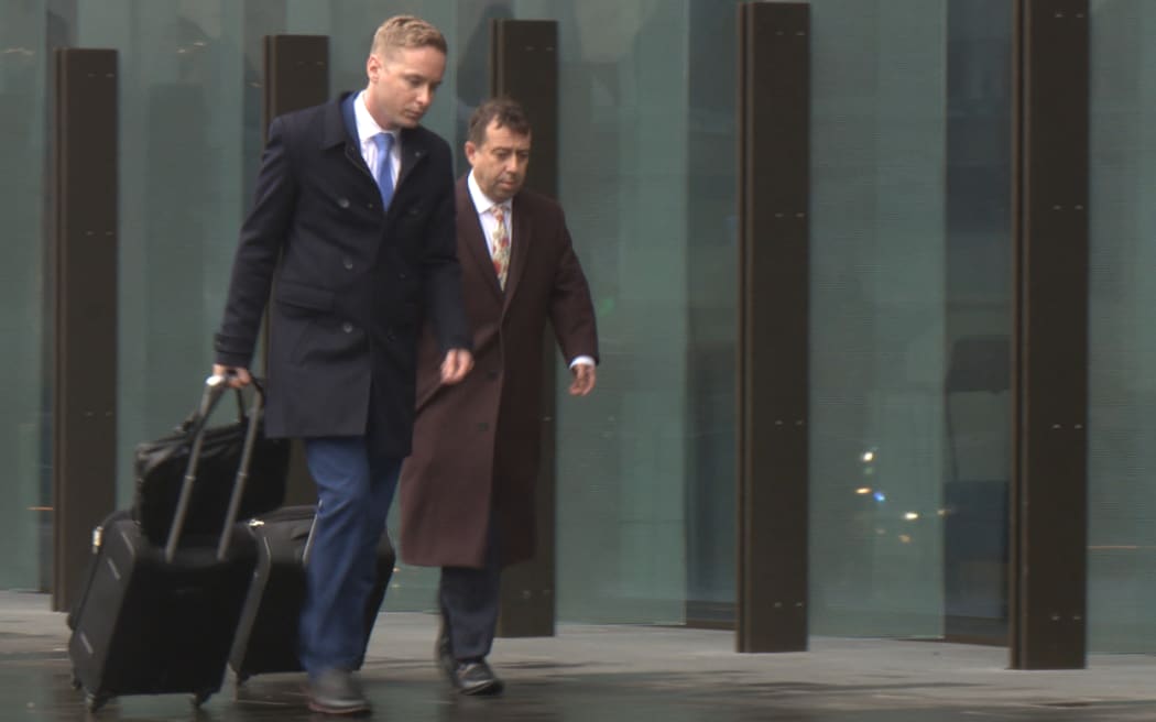 Lawyers for the accused Christchurch mosque attacker, Shane Tait Jonathan Hudson, arrive at court.
