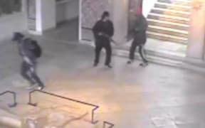 An image grab taken from a closed circuit television footage released by the Tunisian interior ministry of the attackers.
