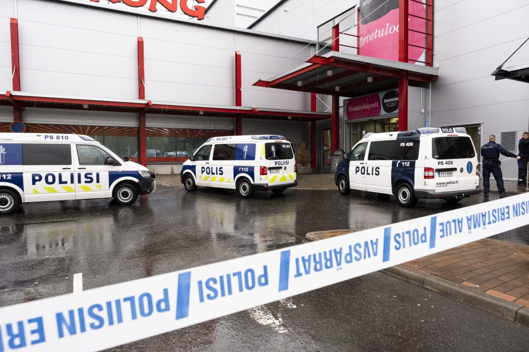 Police cars stand on the blocked grounds of the Hermanni shopping centre in Kuopio, Finland, after an attack occurred on the premises of the Savo Vocational College.