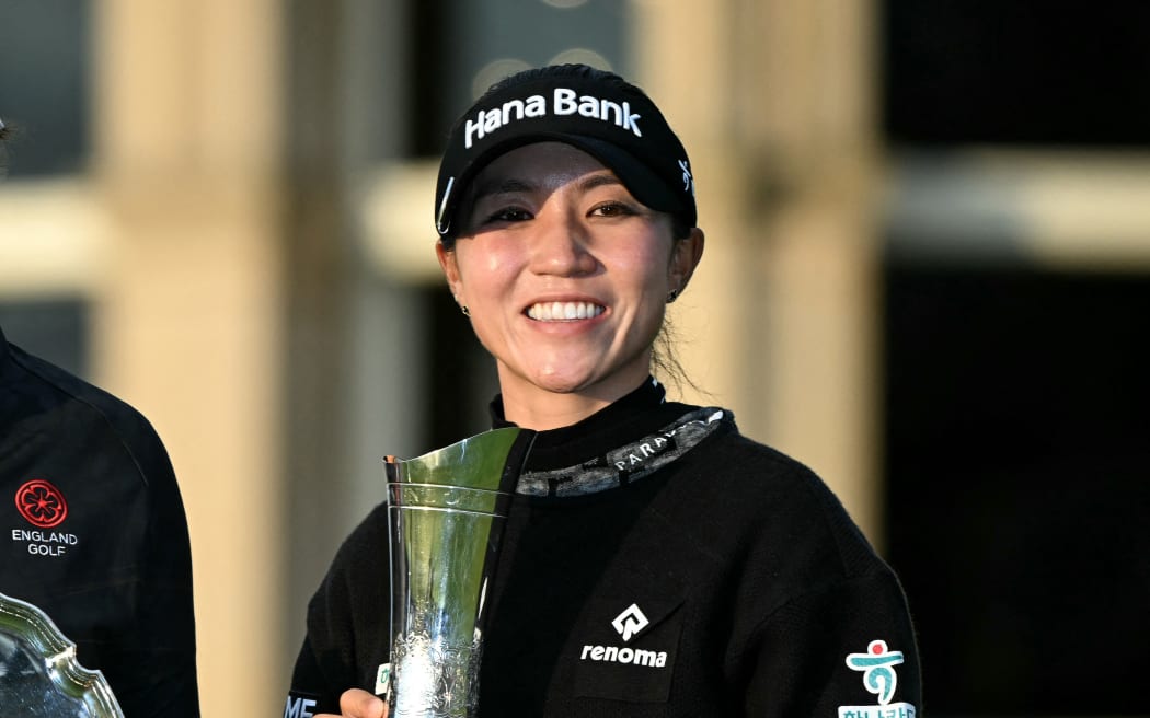 New Zealand's Lydia Ko poses with her trophy on day four of the 2024 Women's British Open Golf Championship, on the Old Course at St Andrews, in St Andrews, Scotland, on August 25, 2024.