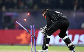 New Zealand's captain Tom Latham runs out India's Suryakumar Yadav during their Cricket World Cup game.