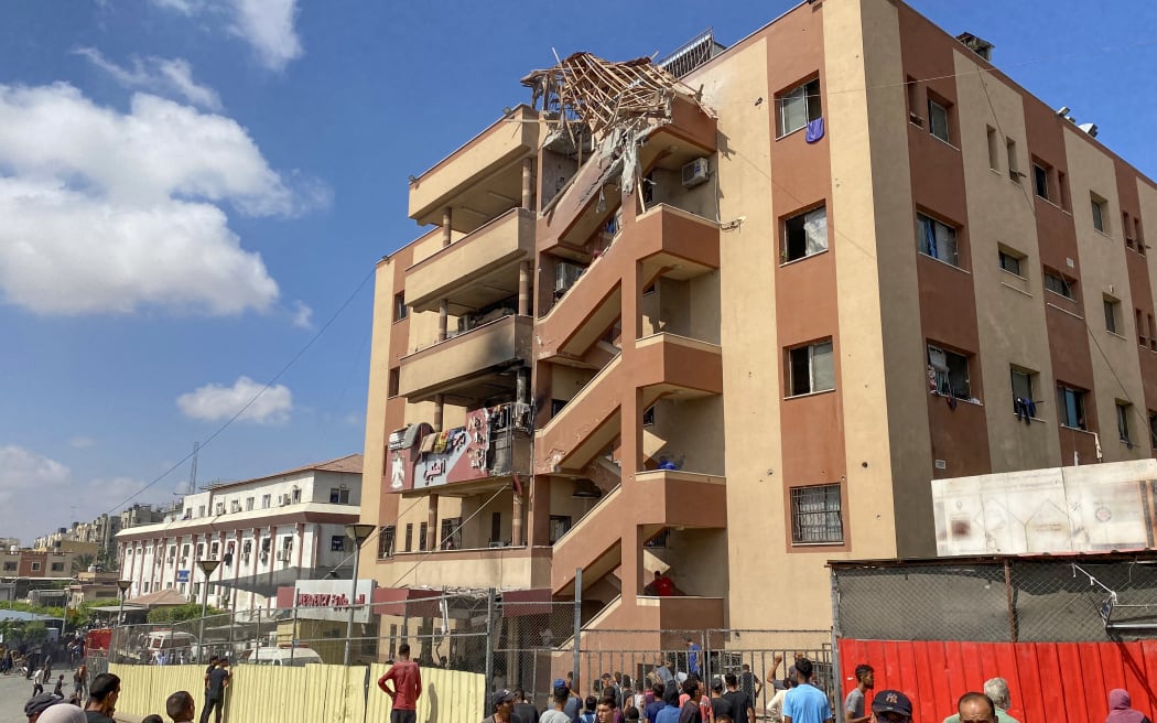 Palestinians gather outside Nasser hospital in Khan Yunis in the southern Gaza Strip following Israeli strikes.