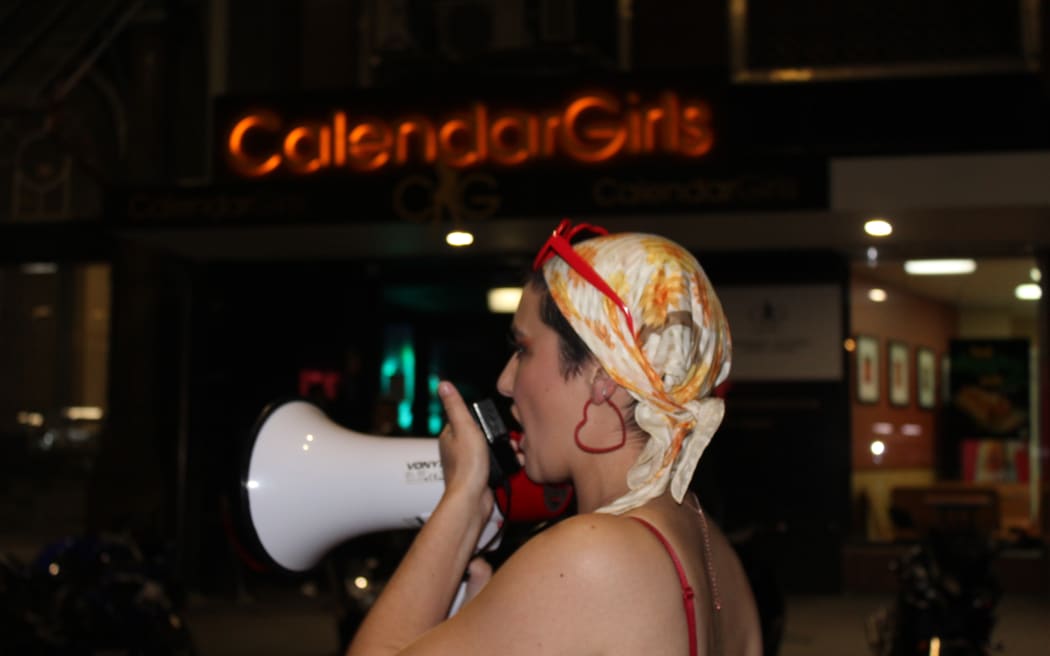 A protester addresses the crowd outside Calendar Girls in Wellington.