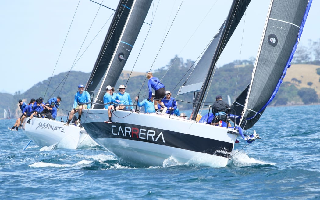 The 40-foot racing yachts Sassinate and Carrera jostle for the lead during last year’s Bay of Islands Sailing Week.