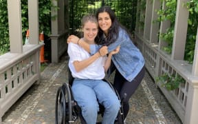 Sophia Malthus and her caregiver and friend Indy.
