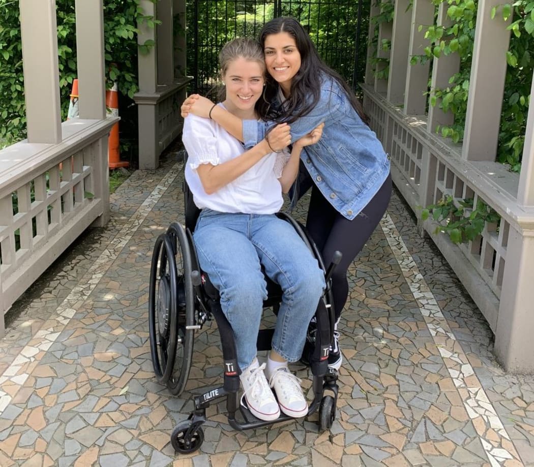 Sophia Malthus and her caregiver and friend Indy.