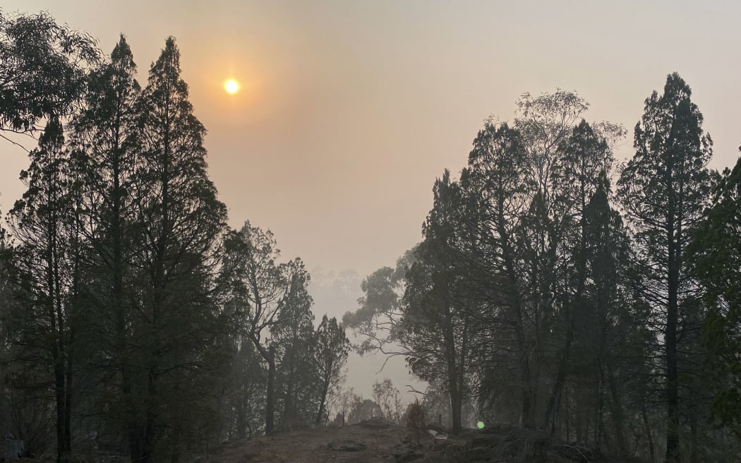 Sun rises over the bushland of Cooma hill resort, some 114 kilometres south of Canberra on January 4, 2020. -
