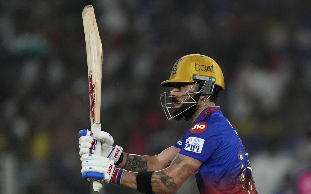 Royal Challengers Bengaluru's Virat Kohli watches the ball after playing a shot during the Indian Premier League eliminator cricket match between Royal Challengers Bengaluru and Rajasthan Royals in Ahmedabad, India, Wednesday, May 22, 2024. (AP Photo/Ajit Solanki)