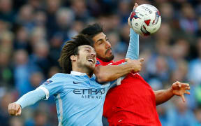 David Silva of Manchester City in action with Emre Can of Liverpool during the 2016 Capital One Cup Final.