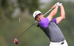 Rory McIlroy tees off on the fifth hole during the fourth round of the PGA Championship, 2014.
