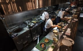 Kitchen staff in Cassia Restaurant on Fort Lane, Auckland City.