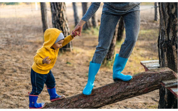 child on log with parent
