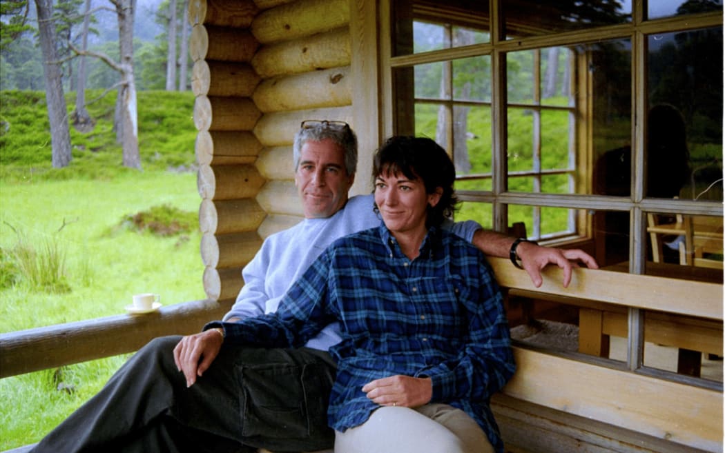 This undated photo provided by the US Justice Department on December 19, 2025 shows Jeffrey Epstein, a wealthy US financier who died in jail in 2019 while awaiting trial for sex trafficking underage girls, and his associate, Ghislaine Maxwell in an unidentified location.