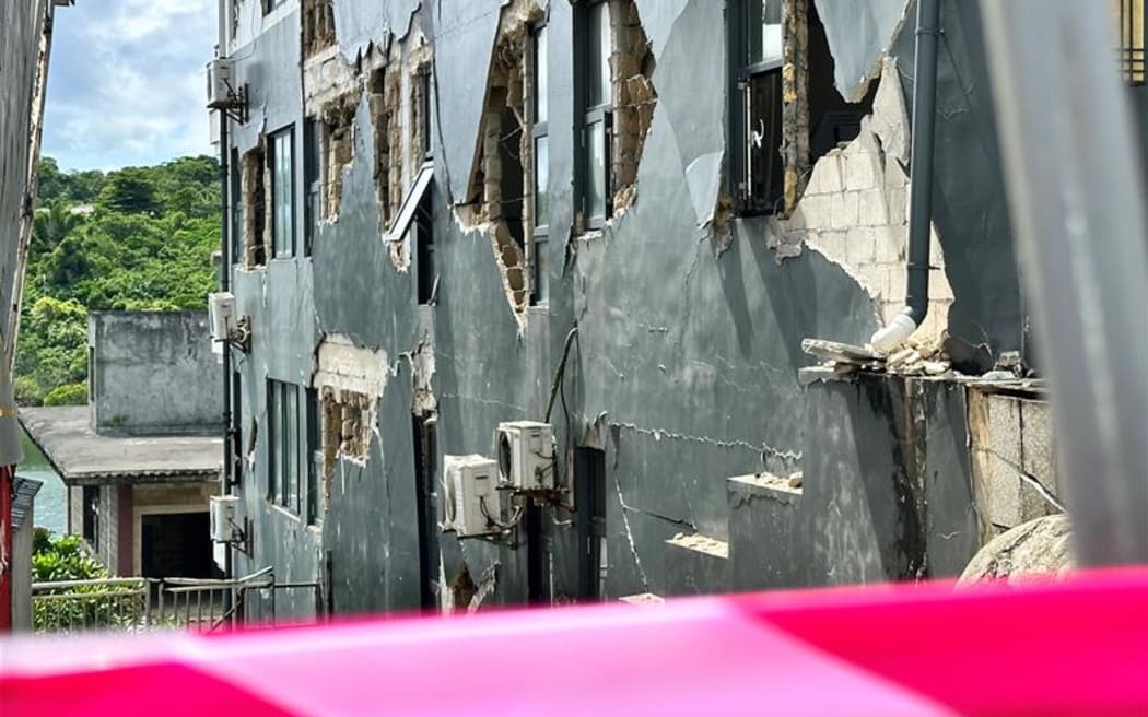 Vanuatu police and mobile force officers are having to force shop owners to leave their damaged buildings.