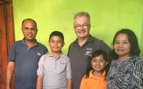 Captain Shaun Fogarty (centre) with Jose Pinto, Mr Pinto’s son Rogerio (12), daughter Xaveria (9) and wife Lina this week.