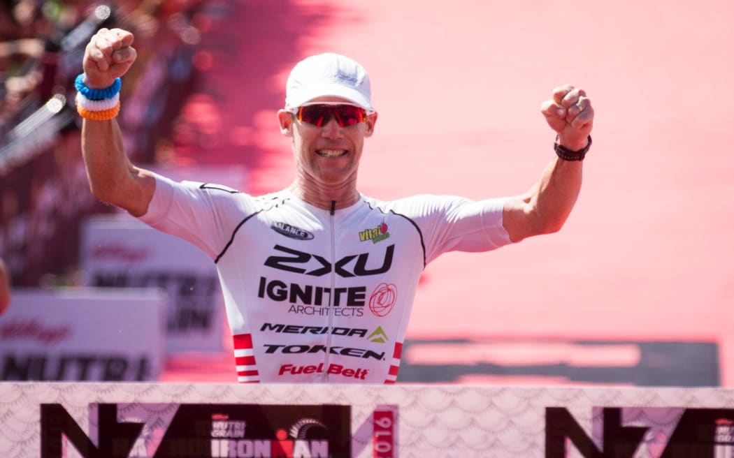 Cameron Brown crosses the finish line to win his 12th Ironman New Zealand, Taupo, New Zealand, 05 March 2016.