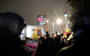 About 700 demonstrators gathered on Berlin's Alexanderplatz with anti-AfD placards after Sunday's election.