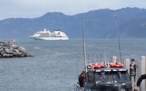 A cruise ship berthed off the coastline at Kaikōura.
