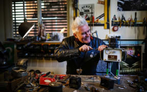 Martin Horspool making a robot in his workship