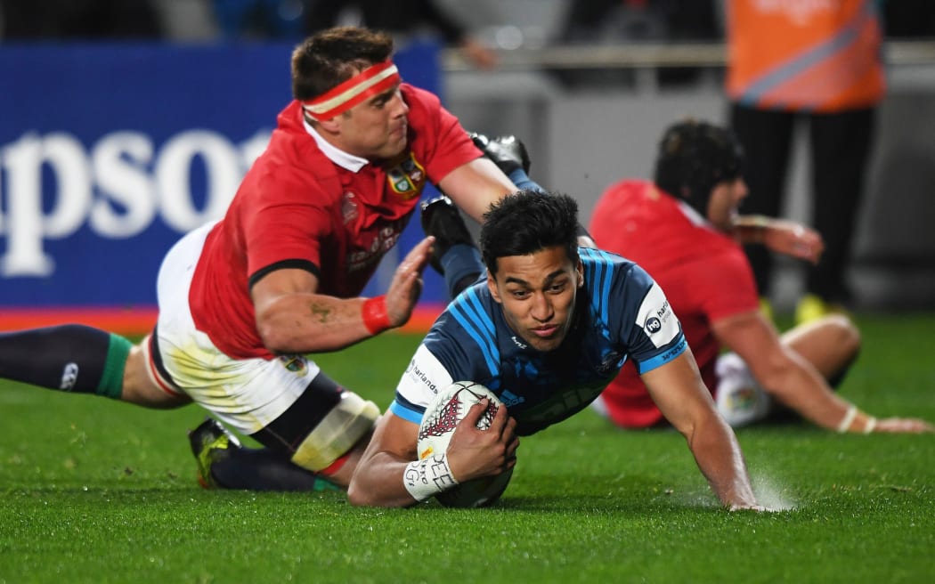 The Blues' Rieko Ioane scores against the Lions.
