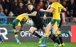 All Blacks first five Beauden Barrett eludes Wallaby defenders.