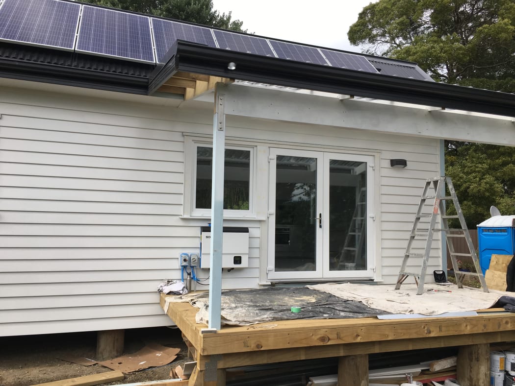 The entrance and deck on the climate safe house.